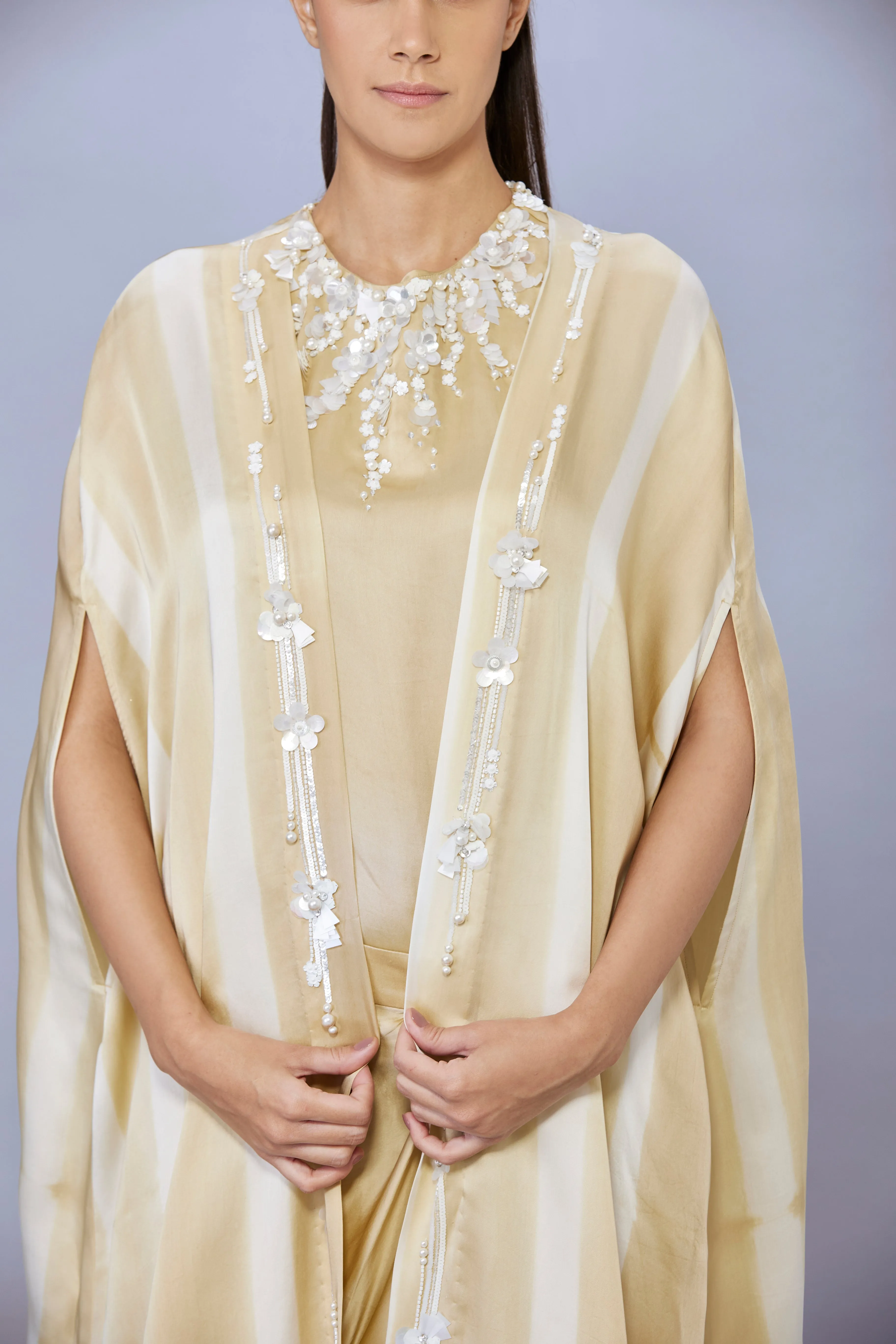 Gold tye dye cape with emb sleeveless emb top & draped skirt